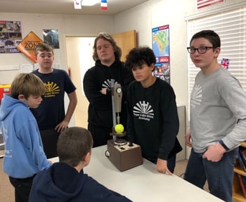 STEM students looking at equipment donated by Syracuse Plastics of North Carolina